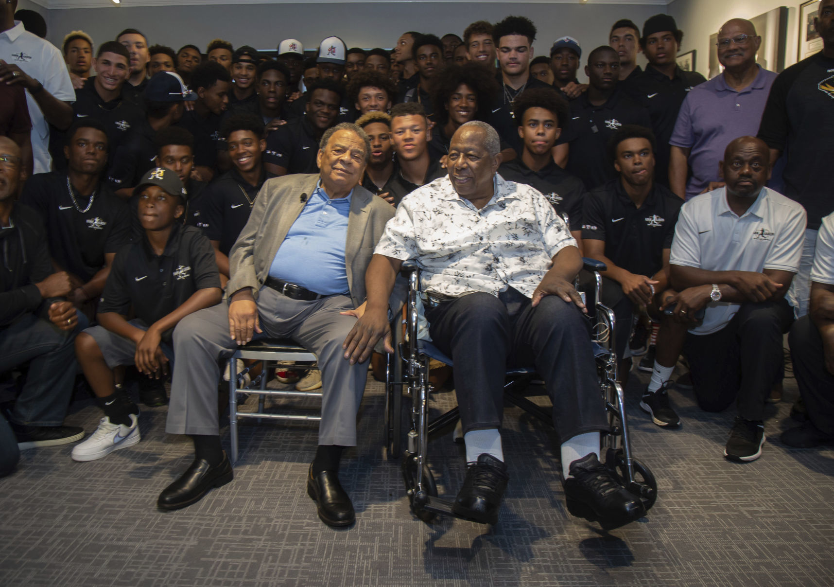 Andrew Young, left, and Hank Aaron, left, pose for photos with the participants at the end of the Hank Aaron Invitational at SunTrust Park in Atlanta on Friday. — Steve Schaefer/Atlanta Journal-Constitution via AP